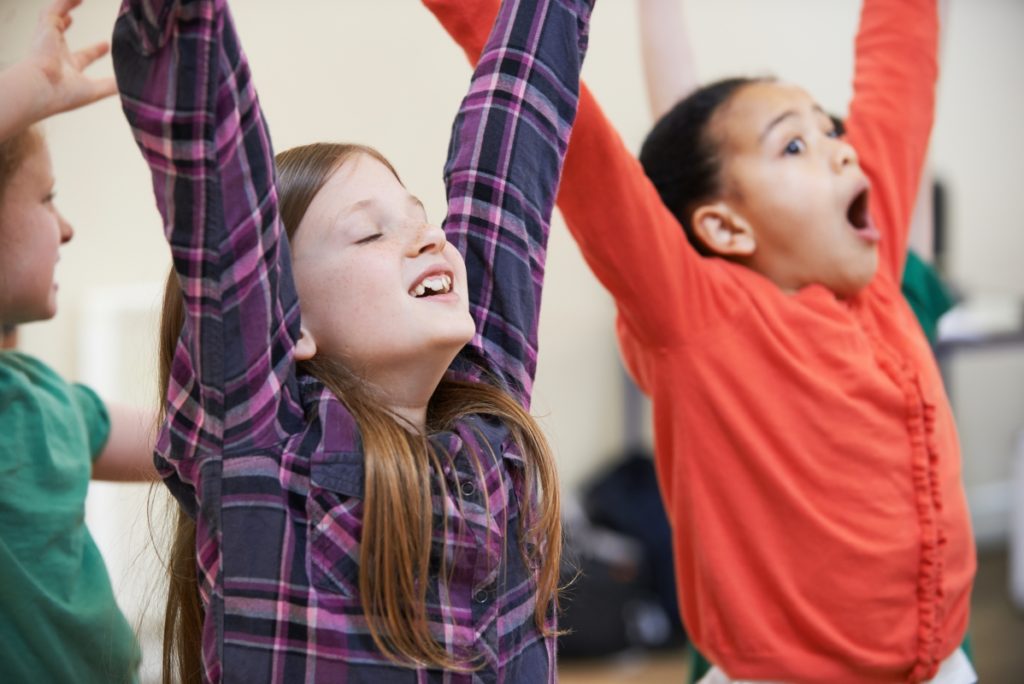 Children with hands in the air